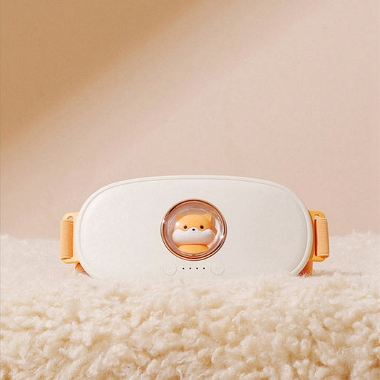 Menstrual pain relief massager on soft fabric surface, designed for effective menstrual cramp relief.